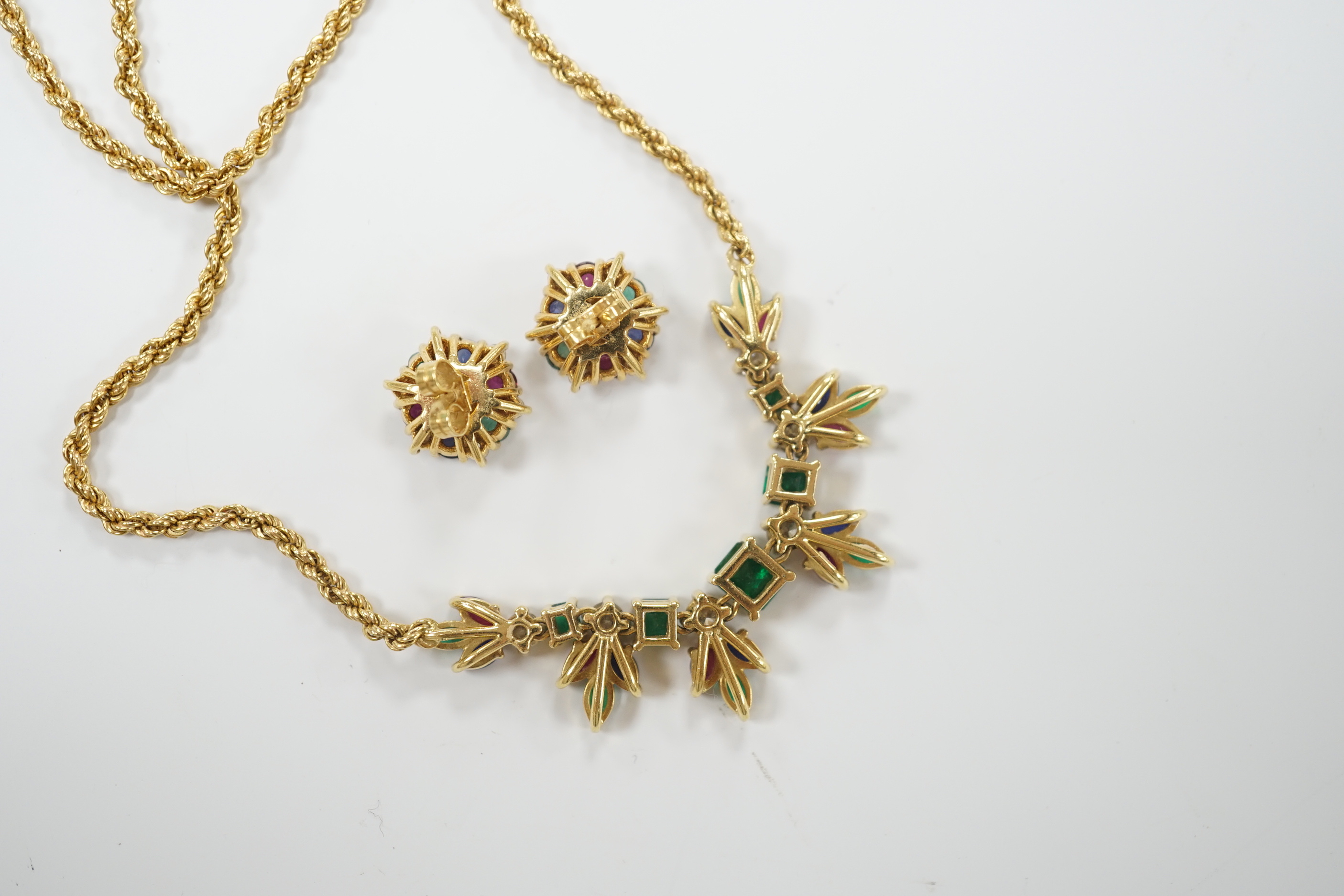 A 1960's? yellow metal, ruby, sapphire, emerald and diamond cluster set 'tutti fruiti' necklace, 44cm and pair of matching ear studs, the butterflies stamped 750